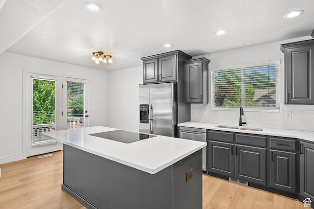 713 S 600 E, Layton, UT 84041 - kitchen featuring stainless steel appliances, healthy amount of natural light, decorative backsplash, light wood finished floors, and recessed lighting