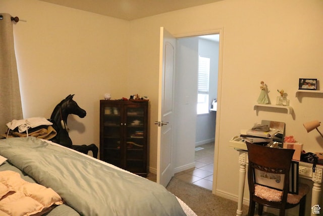 1521 N 420 W Unit 104, Logan, UT 84341 - tiled bedroom featuring carpet floors