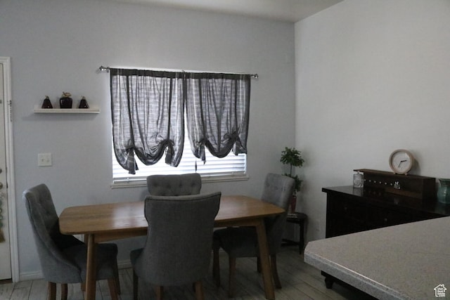 1521 N 420 W Unit 104, Logan, UT 84341 - dining room featuring healthy amount of natural light and light wood-style floors