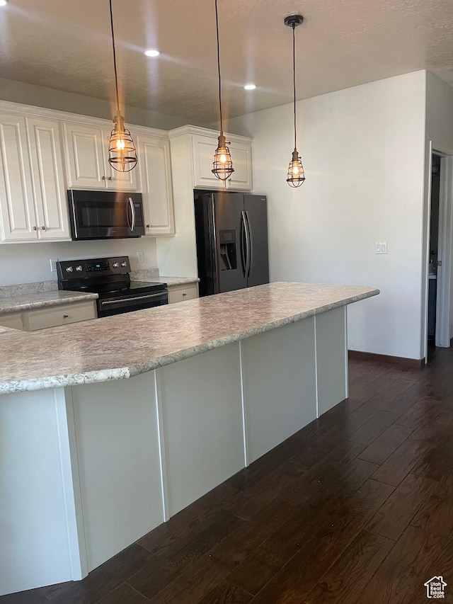 444 E Mitchell Cv Unit 103, South Salt Lake, UT 84115 - kitchen featuring stainless steel fridge, black / electric stove, dark wood-style flooring, and white cabinetry