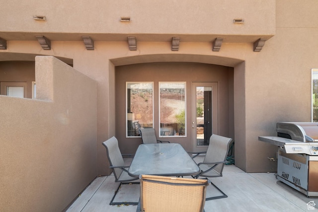 2076 N Doral Ct, Washington, UT 84780 - view of patio with outdoor dining space and a grill
