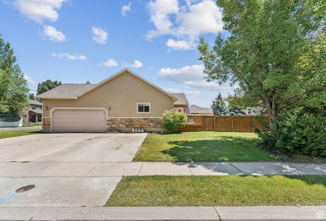 562 E 260 S, Midway, UT 84049 - view of front of house with stucco siding, an attached garage, driveway, and stone siding