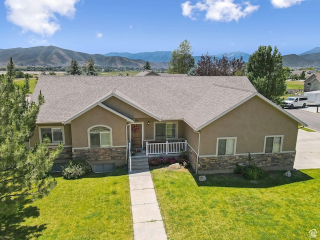 562 E 260 S, Midway, UT 84049 - ranch-style home with stucco siding, stone siding, a mountain view, covered porch, and a front lawn