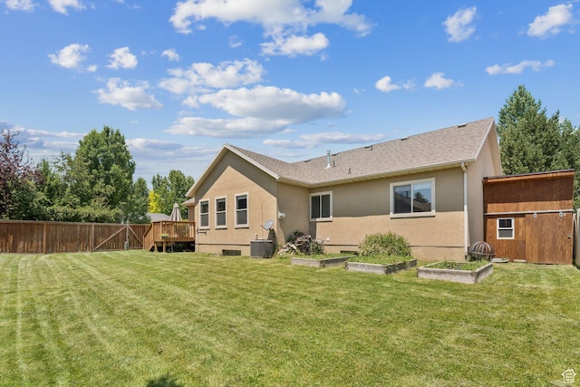 562 E 260 S, Midway, UT 84049 - back of house featuring stucco siding, a vegetable garden, a wooden deck, and a shingled roof