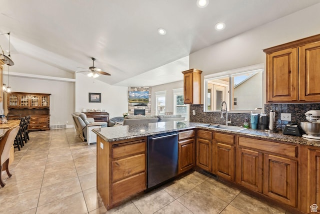 562 E 260 S, Midway, UT 84049 - kitchen featuring stainless steel dishwasher, tasteful backsplash, vaulted ceiling, a ceiling fan, and brown cabinetry