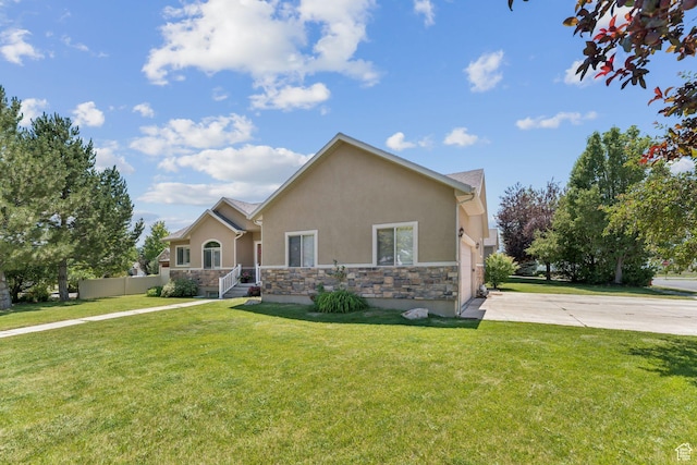 562 E 260 S, Midway, UT 84049 - view of front of home featuring stucco siding, stone siding, driveway, and a front lawn