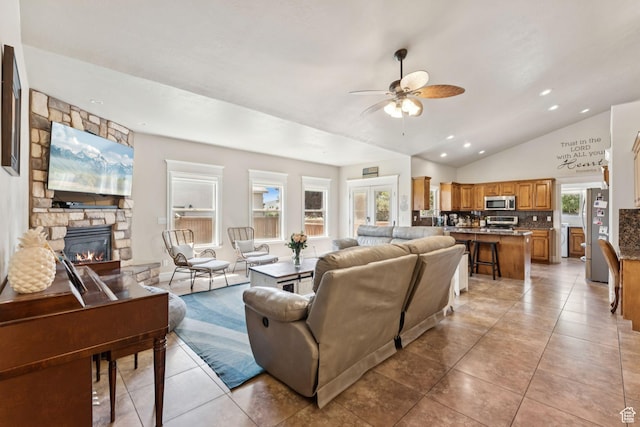 562 E 260 S, Midway, UT 84049 - living room featuring a ceiling fan, lofted ceiling, a stone fireplace, light tile patterned floors, and recessed lighting