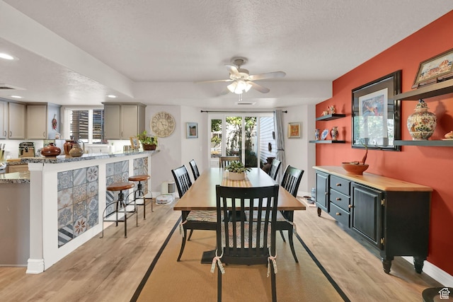 11999 S Draperville Ave, Draper, UT 84020 - dining space featuring light wood-style flooring, a textured ceiling, ceiling fan, and recessed lighting