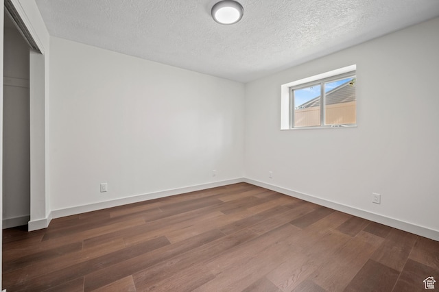 1873 E 5750 S, South Ogden, UT 84403 - unfurnished bedroom with wood finished floors, a textured ceiling, and a closet
