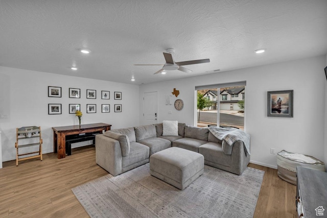 3217 E Elkhorn Ln, Washington, UT 84780 - living room featuring ceiling fan, light wood-type flooring, recessed lighting, and a textured ceiling