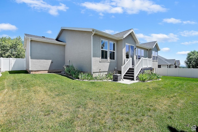 3359 N Redshoulder Dr, Layton, UT 84040 - rear view of property featuring stucco siding and a fenced backyard