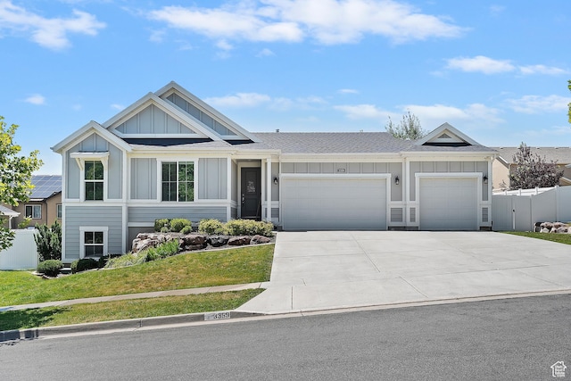 3359 N Redshoulder Dr, Layton, UT 84040 - view of front of home featuring board and batten siding, an attached garage, concrete driveway, and roof with shingles