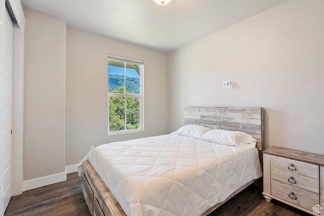 3359 N Redshoulder Dr, Layton, UT 84040 - bedroom with dark wood-type flooring and baseboards