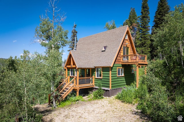 1519 Pine Needle Cir, Coalville, UT 84017 - view of front facade featuring roof with shingles and a deck