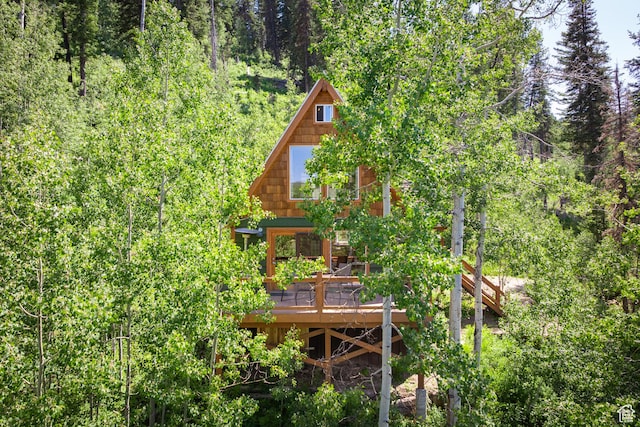 1519 Pine Needle Cir, Coalville, UT 84017 - back of house featuring a deck and a forest view