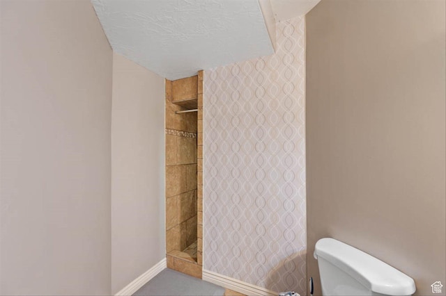 3371 W Waterbridge Cv Unit 417, South Jordan, UT 84095 - bathroom featuring toilet and a tile shower