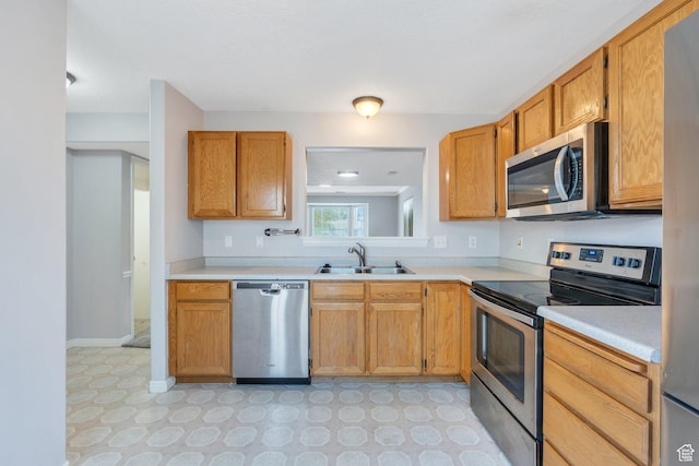 303 E 900 S Unit 42, Payson, UT 84651 - kitchen featuring stainless steel appliances, light countertops, light flooring, and brown cabinets