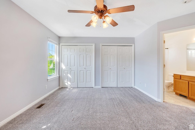 303 E 900 S Unit 42, Payson, UT 84651 - unfurnished bedroom with light carpet, two closets, ensuite bathroom, and ceiling fan