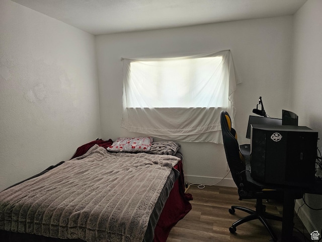 92 W 300 N, Huntington, UT 84528 - bedroom with wood finished floors and a desk
