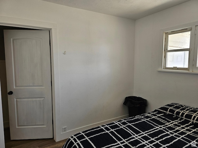 92 W 300 N, Huntington, UT 84528 - unfurnished bedroom featuring dark wood-style flooring