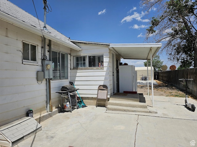 92 W 300 N, Huntington, UT 84528 - back of house with a patio area and roof with shingles