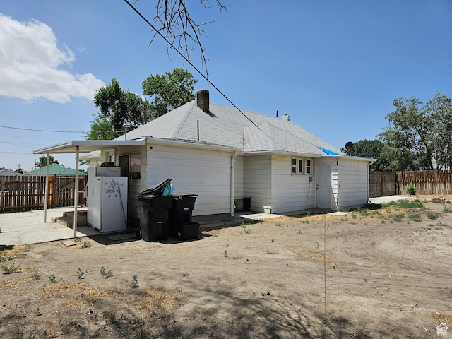 92 W 300 N, Huntington, UT 84528 - rear view of property with a fenced backyard and a chimney