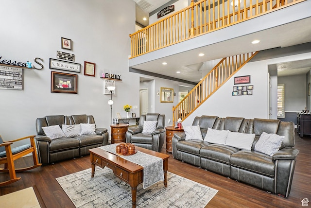 13626 S Bluewing Way, Riverton, UT 84096 - living area featuring stairway, wood finished floors, a towering ceiling, and recessed lighting