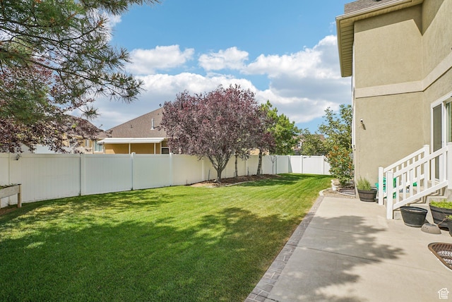 13626 S Bluewing Way, Riverton, UT 84096 - fenced backyard with a patio area