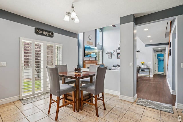 13626 S Bluewing Way, Riverton, UT 84096 - dining area featuring a chandelier, plenty of natural light, and recessed lighting