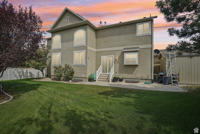 13626 S Bluewing Way, Riverton, UT 84096 - back of house featuring entry steps, stucco siding, and a patio