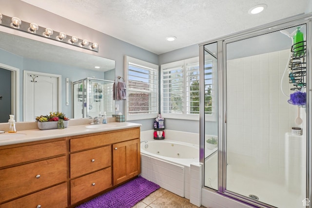 13626 S Bluewing Way, Riverton, UT 84096 - full bathroom with a shower stall, double vanity, a jetted tub, tile patterned floors, and a textured ceiling