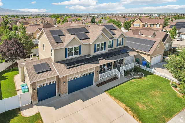 13626 S Bluewing Way, Riverton, UT 84096 - view of front facade featuring a residential view, driveway, roof with shingles, and a fenced backyard