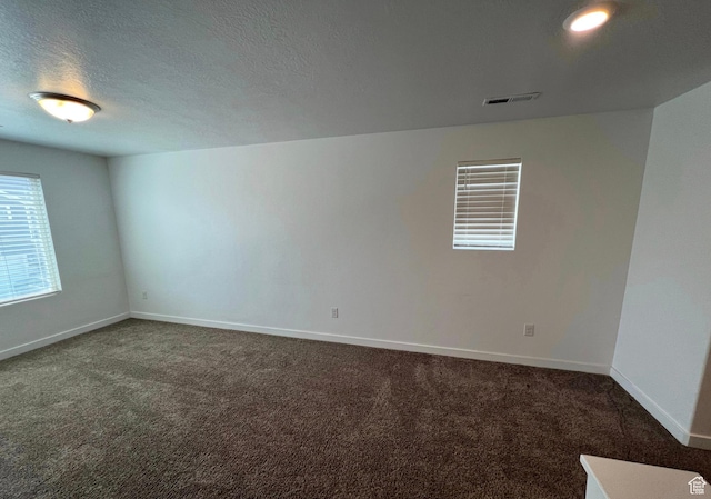 632 N Sugar Beet Dr Unit 224, Lehi, UT 84043 - spare room with dark colored carpet and a textured ceiling