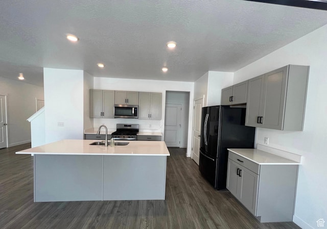 632 N Sugar Beet Dr Unit 224, Lehi, UT 84043 - kitchen featuring appliances with stainless steel finishes, gray cabinets, dark wood-style floors, recessed lighting, and a textured ceiling