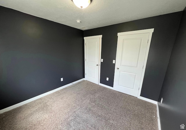 632 N Sugar Beet Dr Unit 224, Lehi, UT 84043 - unfurnished bedroom featuring carpet and a textured ceiling