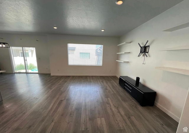 632 N Sugar Beet Dr Unit 224, Lehi, UT 84043 - unfurnished living room featuring dark wood-style flooring, a textured ceiling, and recessed lighting