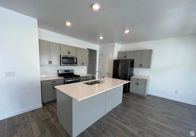 632 N Sugar Beet Dr Unit 224, Lehi, UT 84043 - kitchen featuring appliances with stainless steel finishes, gray cabinetry, dark wood-type flooring, a center island with sink, and recessed lighting