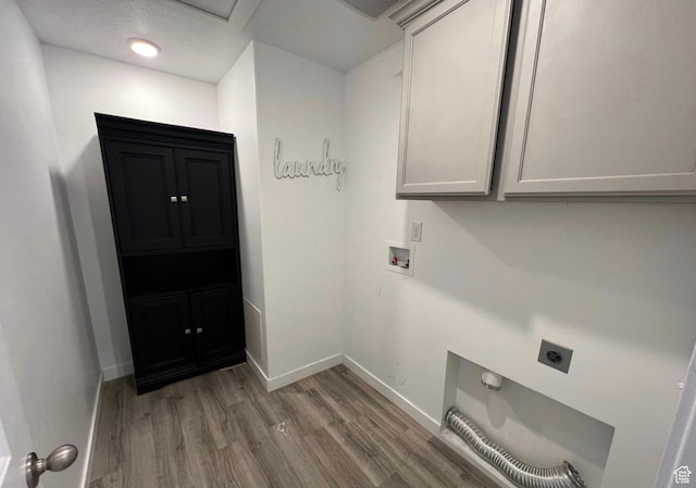 632 N Sugar Beet Dr Unit 224, Lehi, UT 84043 - laundry room featuring electric dryer hookup, cabinet space, and light wood-type flooring