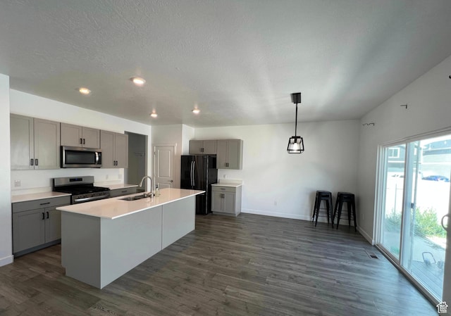 632 N Sugar Beet Dr Unit 224, Lehi, UT 84043 - kitchen featuring appliances with stainless steel finishes, gray cabinets, dark wood-style floors, an island with sink, and recessed lighting