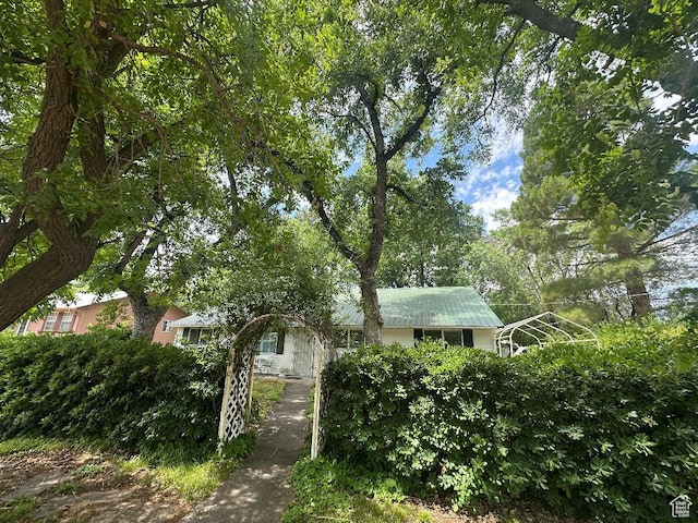 191 N Ash Creek Dr, Toquerville, UT 84774 - view of property hidden behind natural elements featuring a metal roof
