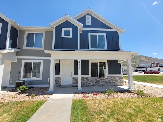 1596 S 3740 E Unit 1358, Spanish Fork, UT 84660 - view of front of house featuring board and batten siding, covered porch, and stone siding