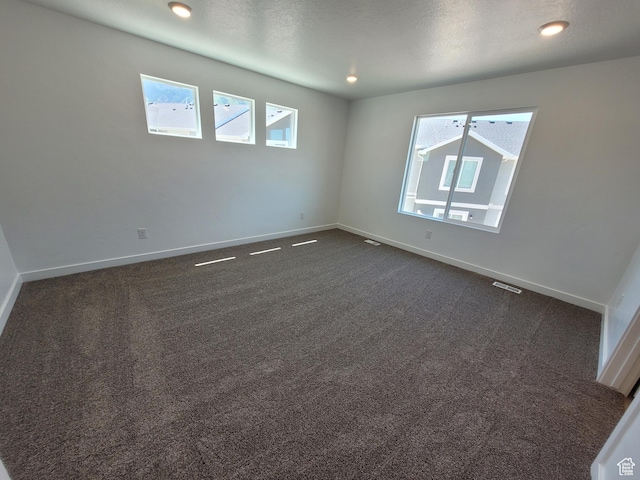1596 S 3740 E Unit 1358, Spanish Fork, UT 84660 - unfurnished room featuring plenty of natural light, dark colored carpet, and recessed lighting