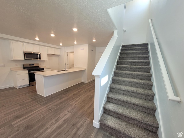 1596 S 3740 E Unit 1358, Spanish Fork, UT 84660 - stairs with recessed lighting, wood finished floors, and a textured ceiling