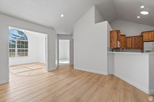 317 S 450 W Unit C, Springville, UT 84663 - unfurnished living room featuring lofted ceiling, light wood-style flooring, and recessed lighting
