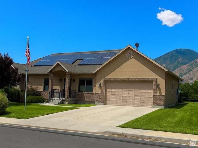 367 E 1400 N, Mapleton, UT 84664 - single story home with an attached garage, brick siding, a front yard, and roof mounted solar panels