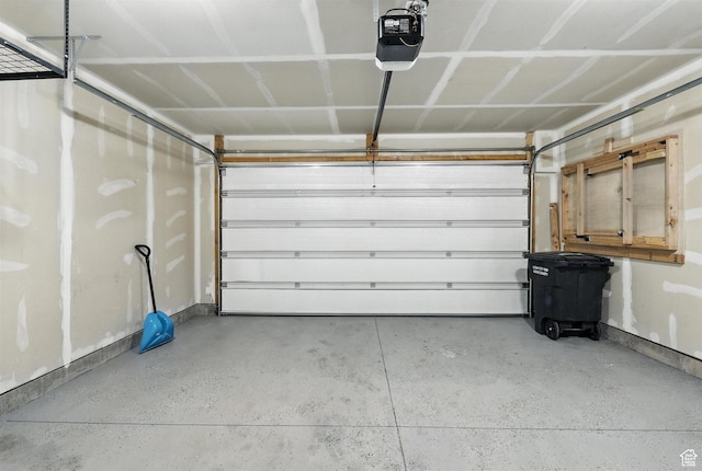 1221 W 1870 S, Logan, UT 84321 - garage featuring a garage door opener and baseboards