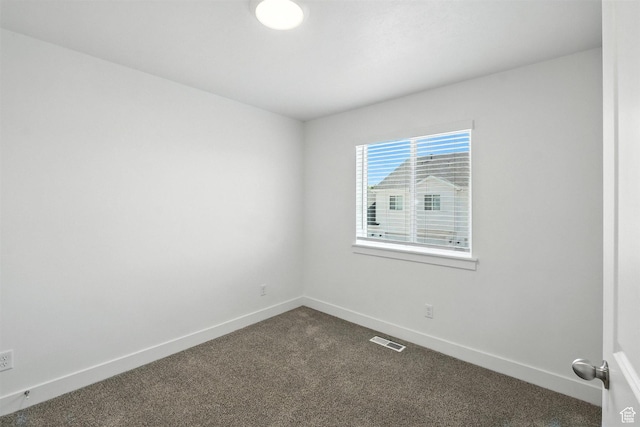 1221 W 1870 S, Logan, UT 84321 - spare room with dark carpet and baseboards