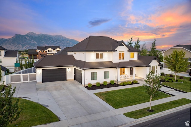 2430 N 325 E, Lehi, UT 84043 - view of front of property with a porch, driveway, a mountain view, a garage, and roof with shingles