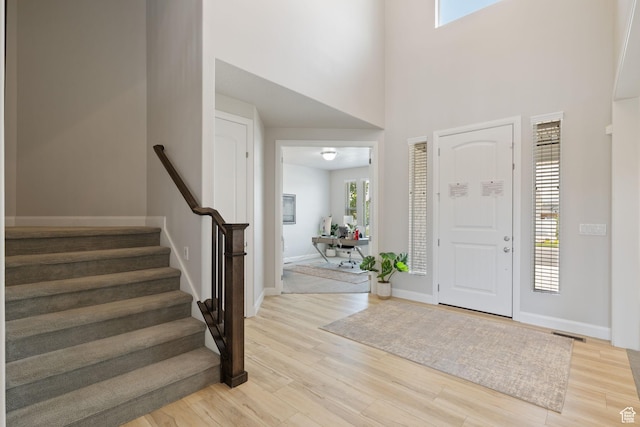 2430 N 325 E, Lehi, UT 84043 - entryway with light wood-style flooring, stairway, and a high ceiling