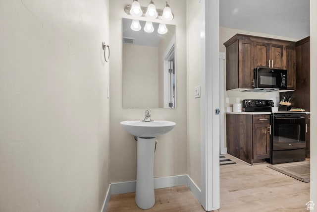 2722 E Iron Bark Aly, Eagle Mountain, UT 84005 - bathroom featuring wood finished floors